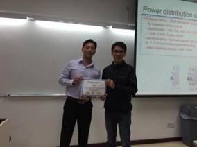 GOLD officer presents souvenir to Eng. Tai